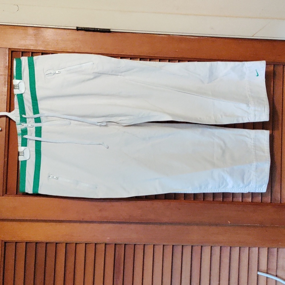 Nike woman size Med white Capri pants with zipper pockets and drawstring waist